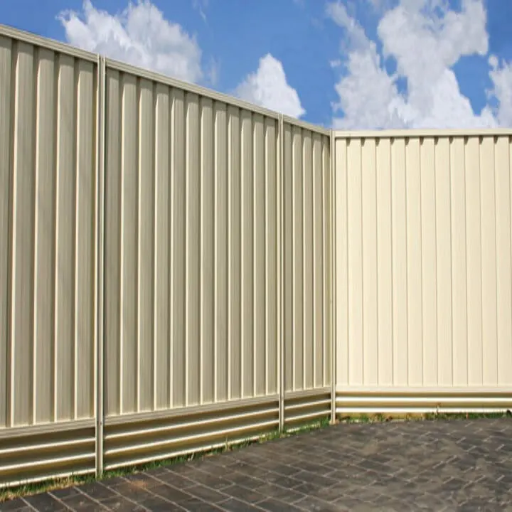 Cream steel boundary fencing under a blue sky